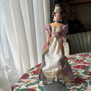 Elegant Doll in Purple and Gold Gown